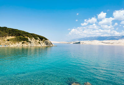 Beautiful bay with turquoise sea water summer. beach under steep coast on pag island in croatia.