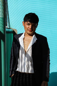 Portrait of young man standing outdoors