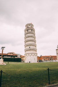 View of tower on field against sky