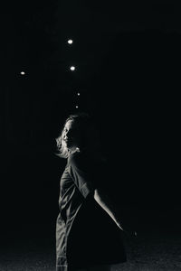 Woman looking at night