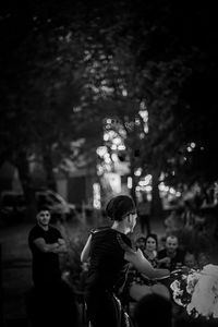 People standing by tree