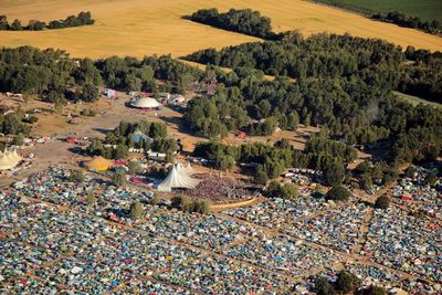 High angle view of tent on field by trees