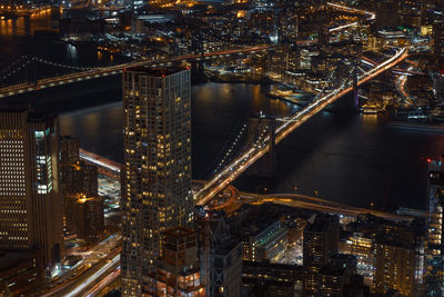 High angle view of illuminated bridge over river at night