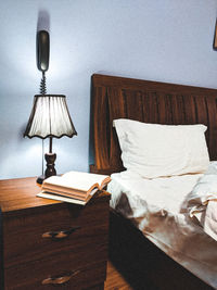 Electric lamp on bed at home