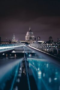 Illuminated buildings in city at night