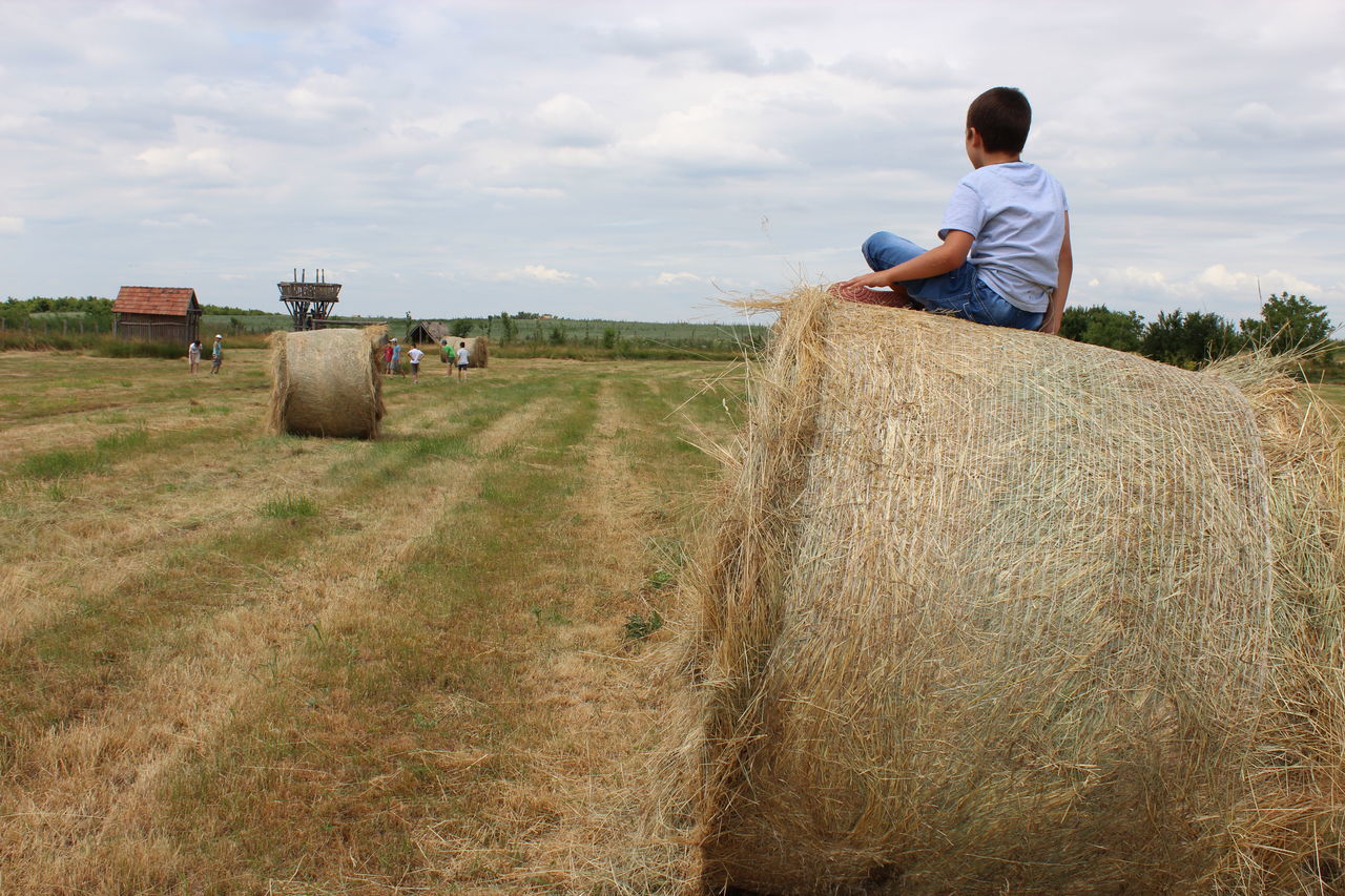 Sitting on a straw bale