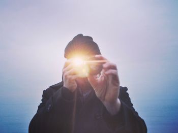 Man photographing at sunset