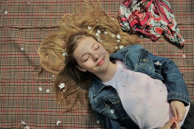 High angle view of woman sleeping on floor