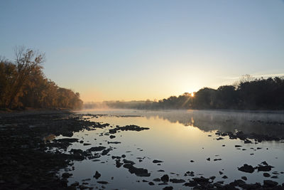 Scenic view of maumee river against clear sky during morning
