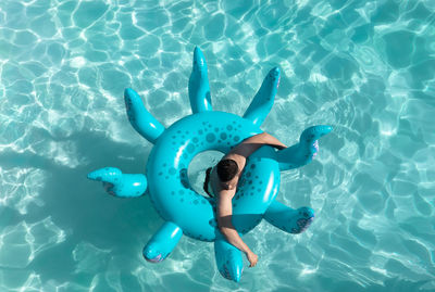 High angle view of man swimming in pool