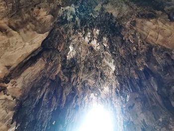 Low angle view of rock formation against sky