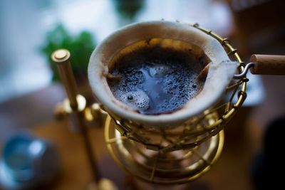 Close-up of coffee cup on table