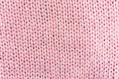 Full frame shot of pink knitted fabric