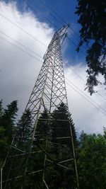 Low angle view of electricity pylon against sky