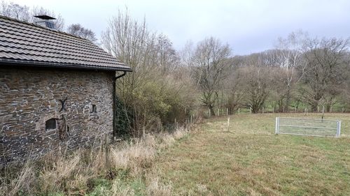 House on field against sky