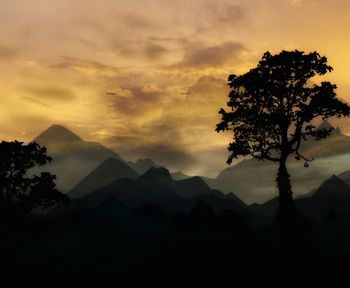 Scenic view of silhouette mountains against sky at sunset