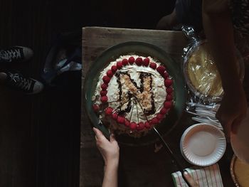 Directly above shot of woman holding ice cream in bowl