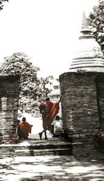 Full length of woman walking in tunnel