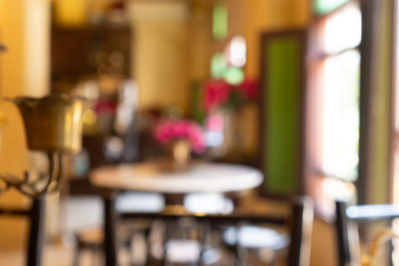 EMPTY CHAIRS AND TABLES AT RESTAURANT