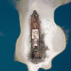 Directly above shoe of ship at island