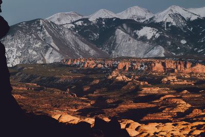 Aerial view of landscape with mountain range in background