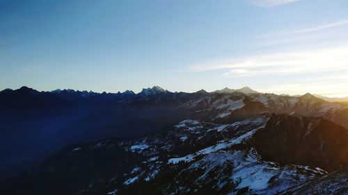 Scenic view of mountains against clear blue sky