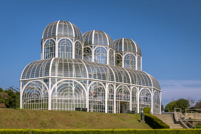 Low angle view of building against clear blue sky