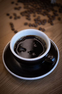 High angle view of coffee cup on table