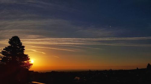 Scenic view of silhouette landscape against sky at sunset