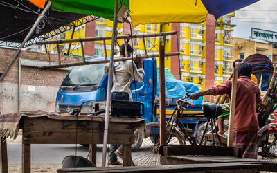 Rear view of people working at construction site