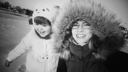 Portrait of smiling woman in snow