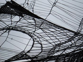 Low angle view of cables against the sky