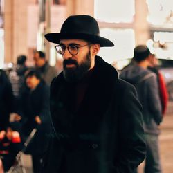 Portrait of young man wearing hat