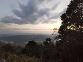 Scenic view of landscape against sky at sunset