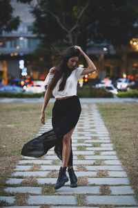 Full length of woman on street in city