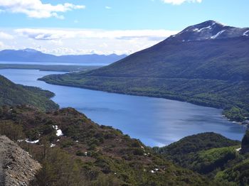 Scenic view of mountains and sea against sky