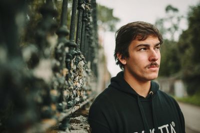 Portrait of young man looking away