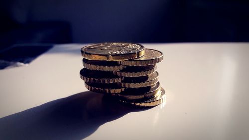 Stack of coins on table