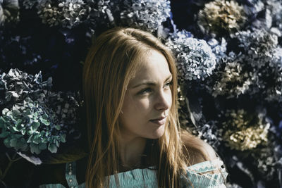 Portrait of young woman looking at camera