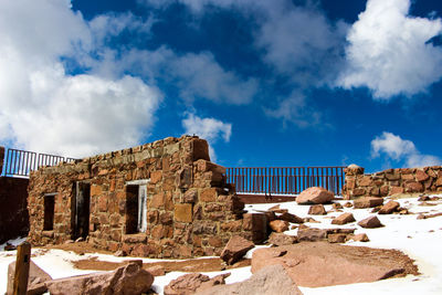 Old ruins against sky during winter