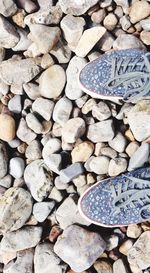 High angle view of pebbles on beach