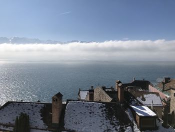 High angle view of buildings by sea