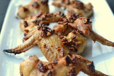 Close-up of chicken wings on plate