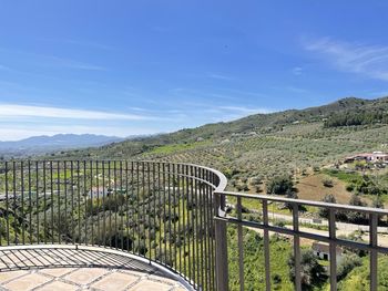 Scenic view of mountains against blue sky at the mirador de cervantes inalora, malaga, spain.