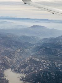 Aerial view of landscape and mountains against sky