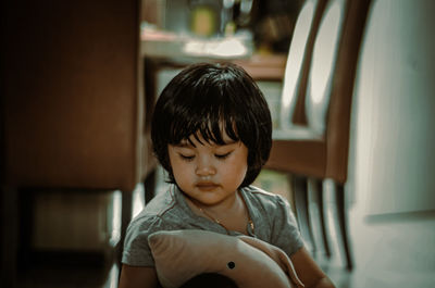 Portrait of boy looking at home