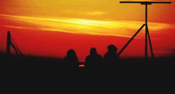 sunset, sky, silhouette, cloud - sky, orange color, nature, people, men, standing, beauty in nature, outdoors, adult, group of people, scenics - nature, lifestyles, dusk, dramatic sky, unrecognizable person, women, leisure activity