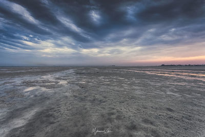 Scenic view of sea against sky at sunset