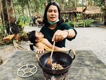 Portrait of woman sitting outdoors