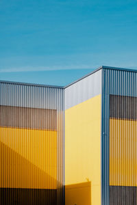 Low angle view of building against clear blue sky
